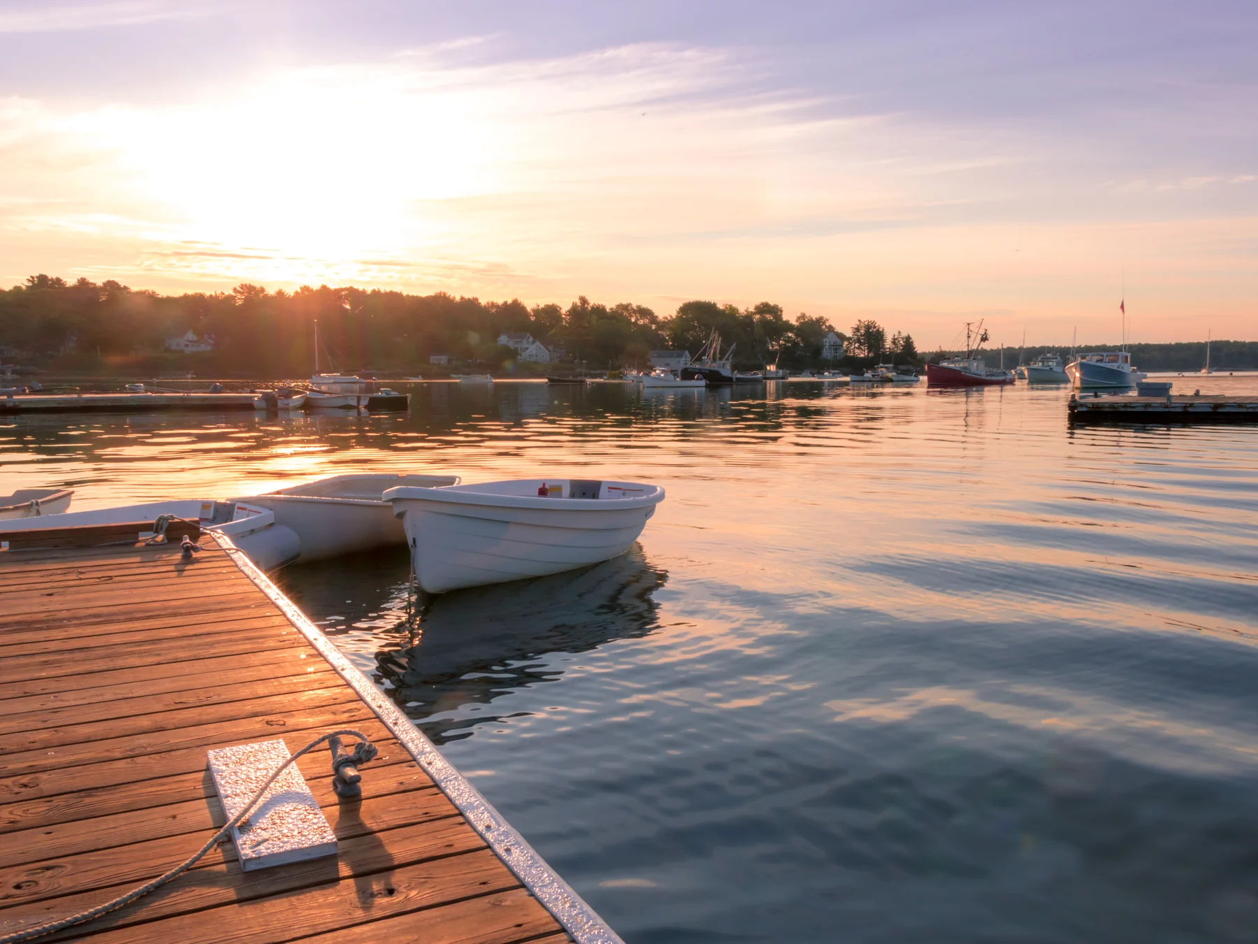 Photo. Dock repair and restoration — restored dock on the water, golden hour