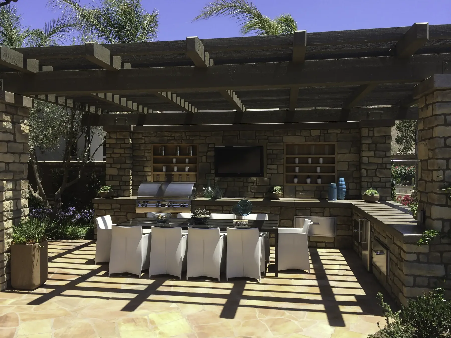 Hero photo. Signature project — wide, warm light, deck or pavilion. Video-ready slot.