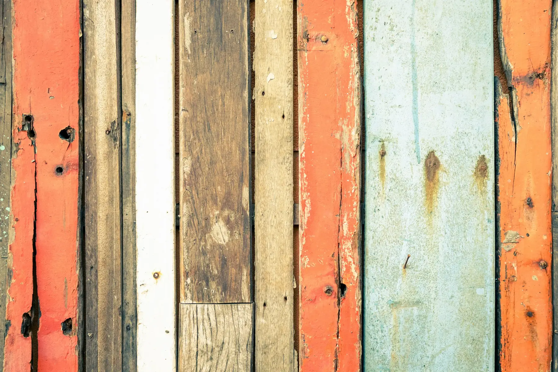 Photo. Salvaged painted boards, original colour left on