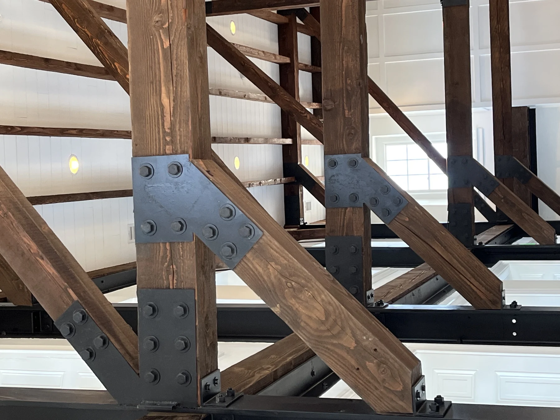 Photo. Steel-plated timber connections seen from below